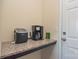 Countertop with coffee maker and ice maker with a door in the background at 173 Glastonbury Dr, Mooresville, NC 28115