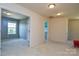 Spacious upstairs hallway with multiple doorways, neutral carpet and walls at 173 Glastonbury Dr, Mooresville, NC 28115