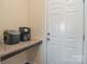 Kitchenette with countertop, perfect for a coffee station and extra storage by an exterior door at 173 Glastonbury Dr, Mooresville, NC 28115