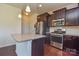 Updated kitchen features stainless steel appliances, granite countertops, and ample cabinet space at 173 Glastonbury Dr, Mooresville, NC 28115