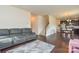 Open concept living area with hardwood floors seamlessly connecting living room and kitchen at 173 Glastonbury Dr, Mooresville, NC 28115