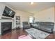 Spacious living room featuring a fireplace, hardwood flooring, and comfortable seating at 173 Glastonbury Dr, Mooresville, NC 28115