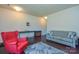 Inviting living room featuring a red chair, gray sofa, and stylish decor for comfortable living at 173 Glastonbury Dr, Mooresville, NC 28115