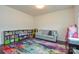 Versatile living room with a cozy couch, a bright window, and practical storage shelves at 173 Glastonbury Dr, Mooresville, NC 28115