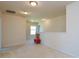 A carpeted loft area featuring recessed lighting, a window, and a half wall at 173 Glastonbury Dr, Mooresville, NC 28115