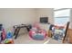 Playroom featuring an air hockey table, TV, and various toys, perfect for entertaining at 173 Glastonbury Dr, Mooresville, NC 28115
