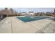 Community pool covered for the off-season, surrounded by a fence and neighboring houses at 173 Glastonbury Dr, Mooresville, NC 28115