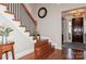 Charming foyer showcasing hardwood floors and an ornate staircase at 1812 Mill Chase Ln, Waxhaw, NC 28173