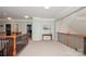 Upstairs hallway with carpet, natural lighting, and views of the staircase at 1812 Mill Chase Ln, Waxhaw, NC 28173