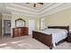 Large main bedroom with a tray ceiling, a dresser, and soft natural light at 1812 Mill Chase Ln, Waxhaw, NC 28173