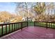 Inviting back deck with wood railing, perfect for outdoor relaxation and enjoying views of the surrounding landscape at 1919 Windlock Dr, Charlotte, NC 28270