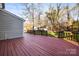 Large back deck offering outdoor living and a view of the expansive yard and detached garage at 1919 Windlock Dr, Charlotte, NC 28270