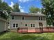 This spacious backyard offers a large deck area and a beautiful view of mature trees at 1919 Windlock Dr, Charlotte, NC 28270