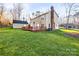 Exterior of home featuring an outdoor wooden deck and beautiful green yard space at 1919 Windlock Dr, Charlotte, NC 28270