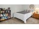 Simple bedroom with carpet flooring, bookshelf, and neutral color scheme at 1919 Windlock Dr, Charlotte, NC 28270