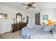 Comfortable bedroom with vaulted ceiling, fan, large dresser, and a cozy bed at 1919 Windlock Dr, Charlotte, NC 28270
