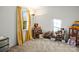 Bright, carpeted bedroom with a window and decorated with shelves of toys at 1919 Windlock Dr, Charlotte, NC 28270
