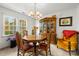 Charming dining room featuring a wood table, hutch, and elegant chandelier at 1919 Windlock Dr, Charlotte, NC 28270