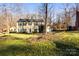 Attractive two-story home with a well-maintained lawn and mature trees at 1919 Windlock Dr, Charlotte, NC 28270
