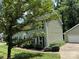 Charming two story home with mature trees and green lawn at 1919 Windlock Dr, Charlotte, NC 28270