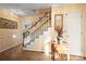 Elegant foyer with stairs, wood flooring, and decorative accents at 1919 Windlock Dr, Charlotte, NC 28270