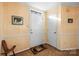 Inviting entryway featuring a white door and patterned wallpaper at 1919 Windlock Dr, Charlotte, NC 28270
