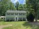 Inviting two-story home features classic architecture, lush landscaping, and a welcoming entrance at 1919 Windlock Dr, Charlotte, NC 28270