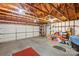 Large detached garage provides ample storage and workspace with exposed rafters at 1919 Windlock Dr, Charlotte, NC 28270