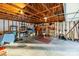 Spacious detached garage with exposed wood rafters offers ample space for storage and projects at 1919 Windlock Dr, Charlotte, NC 28270