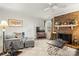 Inviting living room with a brick fireplace, comfortable seating, and a ceiling fan at 1919 Windlock Dr, Charlotte, NC 28270