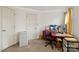 Functional office space with carpet floors, desk, and ample storage at 1919 Windlock Dr, Charlotte, NC 28270