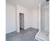 Spacious bathroom with gray tile flooring and a modern tiled shower stall at 236 Mark Ryan Ln, Dallas, NC 28034