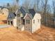 New brick home with a two-car garage and covered entry awaits landscaping at 236 Mark Ryan Ln, Dallas, NC 28034