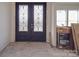 Elegant foyer with decorative glass double doors and abundant natural light at 236 Mark Ryan Ln, Dallas, NC 28034