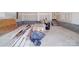 Unfinished garage showing concrete walls, stairs, and construction materials at 236 Mark Ryan Ln, Dallas, NC 28034