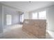 Unfinished living area showing doorway and large window bringing in natural light at 236 Mark Ryan Ln, Dallas, NC 28034