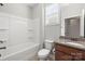 A bathroom featuring a tub/shower combo, single sink vanity, and granite countertops at 2479 Seagull Dr, Denver, NC 28037
