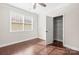Bedroom featuring hardwood floors, a window, and an open closet for extra storage space at 2479 Seagull Dr, Denver, NC 28037
