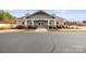 Exterior of community clubhouse surrounded by meticulously kept landscaping at 2479 Seagull Dr, Denver, NC 28037