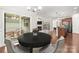 Bright dining area open to kitchen with stainless steel appliances and easy access to outdoor patio space at 2479 Seagull Dr, Denver, NC 28037