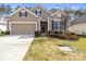 Charming home featuring a two-car garage, manicured lawn, and warm, inviting curb appeal at 2479 Seagull Dr, Denver, NC 28037