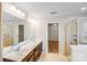 Bathroom with double vanity, walk-in shower, and separate water closet at 2679 Southern Trace Dr, Waxhaw, NC 28173
