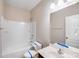 Clean bathroom features a shower-tub combo, neutral walls, vanity, and a well-lit mirror at 2679 Southern Trace Dr, Waxhaw, NC 28173