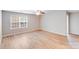 Bedroom features a large window, ceiling fan, and hardwood-style flooring at 2679 Southern Trace Dr, Waxhaw, NC 28173