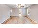 Large bedroom featuring hardwood floors, a ceiling fan, and abundant natural light at 2679 Southern Trace Dr, Waxhaw, NC 28173