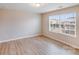 Bedroom with vinyl floors, neutral paint, and window to let in natural light at 2679 Southern Trace Dr, Waxhaw, NC 28173
