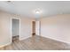 Bedroom with hardwood floors, neutral paint, and a walk in closet at 2679 Southern Trace Dr, Waxhaw, NC 28173