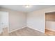Neutral bedroom featuring wood-look floors, ample natural light, and a minimalist design at 2679 Southern Trace Dr, Waxhaw, NC 28173