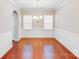 Elegant dining room featuring hardwood floors, wainscoting, a chandelier, and plenty of natural light at 2679 Southern Trace Dr, Waxhaw, NC 28173