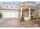 Charming two-story home with a two-car garage and inviting front porch, showcasing a well-maintained exterior and landscaping at 2679 Southern Trace Dr, Waxhaw, NC 28173
